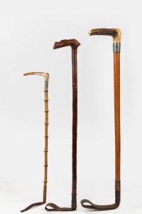 Three assorted antique and vintage riding crops, one with silver collar, 19th/20th century, the largest 70cm long