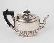 An antique English sterling silver teapot by Walker & Hall of Sheffield, circa 1895, 13cm high, 380 grams total