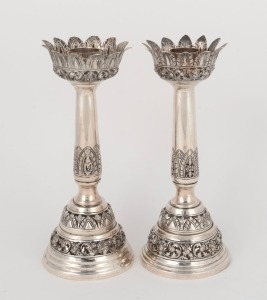 A pair of engraved silver candlesticks, South-East Asian origin, 20th century, stamped "900", maker's mark illegible, 19cm high, 428 grams total