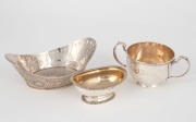 A fine antique Georgian sterling silver salt cellar, a sterling silver two handled cup and an 800 silver bon-bon dish, 19th and 20th century, (3 items), the largest 17cm wide, 416 grams total