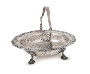 An antique Rococo English sterling silver basket by the famed female silversmith ELIZABETH GODFREY (formerly Elizabeth&nbsp;Buteux)&nbsp;of London, circa 1749, 27cm high, 36cm wide, 1606 grams