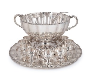 An impressive Continental 925 Sterling silver punch set comprising of a tray, two-handled punch bowl, ladle, and 12 cups. 20th century, the tray 55cm diameter, 7382 grams