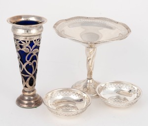 A pair of sterling silver pierced dishes, a sterling silver comport with weighted base, and a pierced sterling silver vase with blue glass liner and weighted base (four items), the vase 18cm high
