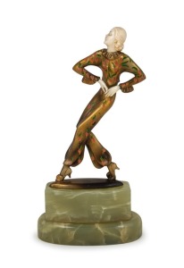 An Austrian Art Deco gilt bronze and ivory statue of a lady with cold&nbsp;painted finish, mounted on green onyx base, circa 1935, engraved "AUSTRIA" on the base, 19.5cm high