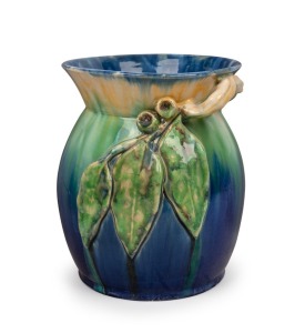 REMUED blue and green glazed pottery vase with applied gumnuts, leaves and branch handle, incised "Remued, Hand Made, 300LM", an imposing 23cm high, 20.5cm wide