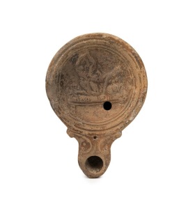 A Roman terracotta oil lamp with erotic scene, 1st - 2nd century A.D., with CofA from Ancient Art Gallery, Stormbroek, ​​​​​​​10cm high