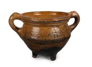 An antique Dutch earthenware cooking pot with tripod base and two handles, circa 1575, excavated near Amsterdam, with letter of authenticity from Adam Langweiler, D.C., 15cm high, 25cm wide