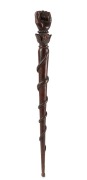 An antique Australian stock whip handle with carved fist end, rope twist and acanthus decoration, plus carved snake adornment, 19th century, 46cm long