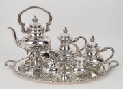 A vintage German 925 sterling silver tea service comprising of a spirit kettle, tea pot, hot water pot, milk jug, and sugar bowl; together with an attractive silver-plated serving tray. 20th century, (six items), stamped "Original Alt-Heidelberg, 925 Ster