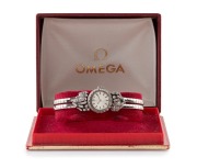 OMEGA 18ct white gold lady's cocktail wristwatch with brilliant cut white diamond set bezel and shoulder mounts, housed in an Omega box, ​​​​​​​22.7 grams including movement
