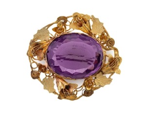 An antique Colonial Australian yellow gold brooch with foliate design, set with an impressive purple stone, circa 1850s, ​​​​​​​4cm wide, 13.5 grams total