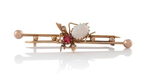 An antique Australian 15ct gold, opal and red stone bee brooch, Melbourne origin, 19th/20th century, 6.3cm wide, 5.7 grams