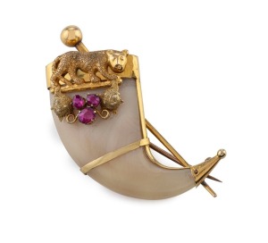 An antique Indian tiger claw brooch, set in 22ct yellow gold with three cut rubies, 19th century, 5cm high