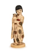 A fine quality antique Japanese Okimono of a young girl and cat with carved and hand-painted decoration, Meiji Period, red seal mark to base, 18cm high