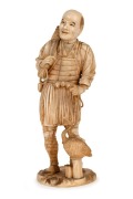 A fine quality antique Japanese carved ivory Okimono of a fisherman with his cormorant, Meiji Period, red seal mark to base, 15.5cm high