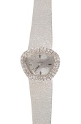 OMEGA spectacular 18ct white gold case and bracelet lady's evening watch with double diamond bezel, housed in original box, case stamped "18K, 750", 51.8 grams including movement
