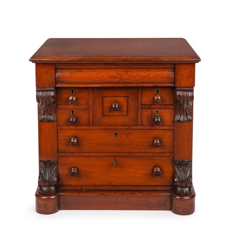 An antique Australian cedar apprentice chest, handsomely crafted with carved corbels top and bottom, circa 1875, full cedar construction with faint ink stamp to reverse "Mitchell, 238 Gratton Street, Carlton", 36cm high, 36cm wide, 25cm deep