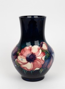 MOORCROFT "Anemone" pattern English pottery vase on blue and green ground, impressed signature mark "W. Moorcroft. Potter To H. M. The Queen. Made In England", 22cm high