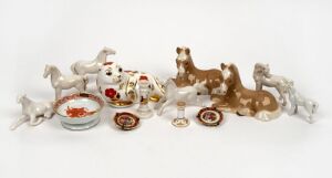 ROYAL CROWN DERBY English porcelain seal pup statue, HEREND porcelain dish, eight assorted porcelain horse statues, GOSS porcelain miniature candlestick, SPODE porcelain miniature candlestick and a pair of LIMOGES miniature plate ornaments, 20th century, (14 items), the seal 13cm wide