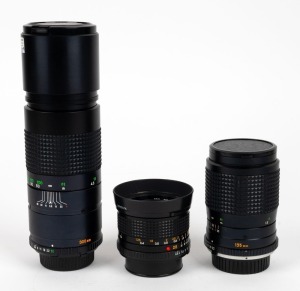 MINOLTA: Three lenses in black - one MD Tele Rokkor 300mm f5.6 with front and rear caps, one MD 28mm f2.8 with lens hood and rear cap, and one MC Tele Rokkor-QD 135mm f3.5 with front and rear caps. (3 lenses)