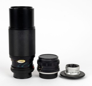 MINOLTA: Group of three lenses - one E. Rokkor 50mm f4.5, one Auto Rokkor-PF 55mm f1.8 with front and rear lens caps, and one MD Zoom 75-200mm f4.5 lens with rear cap. (3 lenses)