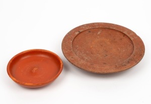 Two Roman terracotta serving bowls, 2nd century A.D., the smaller bowl with Roman potter's stamp, 15cm and 25cm diameter