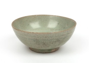 An antique Chinese celadon glazed bowl, 17th/18th century, 5.5cm high, 13.5cm diameter