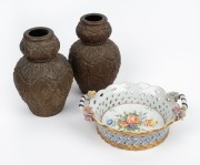 An antique French pierced and floral porcelain table basket, together with a pair of English pottery vases with bronzed finishes, 19th/20th century, (3 items), ​​​​​​​the basket 24cm across the handles.