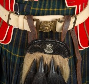 A circa 1890s Scottish Cadet Officer's tunic from Victoria. The tunic is doublet-style with collar badges, and is displayed together with a kilt (probably early 20th Century), a waistbelt&nbsp;of correct Slade-Wallace type, a sporran which dates to 1935 and sp - 8