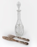 A pair of antique engraved silver fish servers, together with a crystal wine decanter, 19th and 20th century, ​​​​​​​the decanter 39cm high