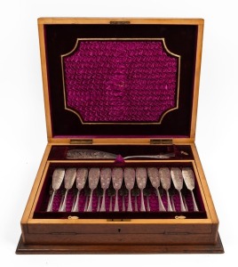 An antique silver plated fish cutlery set for twelve with engraved decoration and server, housed in a walnut canteen, 19th century, the canteen 46cm wide