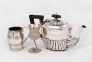An English&nbsp;sterling silver teapot with timber handle and finial; together with a Georgian barrel-shaped measure and a Scottish thistle shaped whisky cup, 19th and 20th century, (3 items), the teapot 12cm high, 386 grams (including handle)