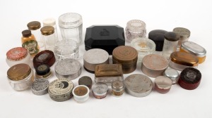 Thirty two assorted cosmetics jars, powder pots and ointments, glass, aluminium and bakelite, ​​​​​​​the largest 9.5cm high
