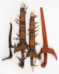 Four assorted kris blades in scabbards, South East Asian origin, ​​​​​​​the largest 50cm long overall