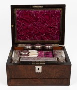 An antique burr walnut travelling&nbsp; dressing box, attractively fitted with silver plated and mother of pearl utensils, jars and bottle, 19th century, ​​​​​​​70cm high, 33cm wide, 23cm deep