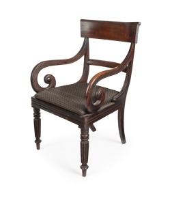An early Colonial Australian cedar carver chair, scroll arm supports with finely fluted and turned legs, Tasmanian origin, circa 1840, 92cm high, 56cm across the arms