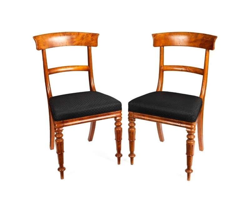 A pair of Colonial huon pine spade back dining chairs with centurion carved skirt decoration to the legs and black horsehair upholstered seats, Tasmanian origin, circa 1840s, 87cm high