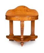 An antique Australian huon pine half round hall table with floral carved centre serpentine leg, circa 1865, ​​​​​​​105cm high, 91cm wide, 53cm deep