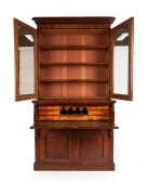 An antique Colonial secretaire, handsomely crafted with ribbon grain selected cedar with crossbanding and carved corbels, beautifully fitted with drawers and compartments in birdseye huon pine, with whalebone handles and ebonised trim, Melbourne origin, c - 2