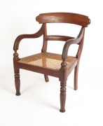 An antique Australian cedar spade back gentleman's library chair with rattan upholstery (A/F), Sydney origin, mid 19th century,