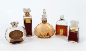 Five assorted French glass perfume bottles including COTY, CARON, and L'AMOUR DAN LE COEUR, the largest 12cm high