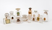 Twelve assorted French glass perfume bottles, some with original labels, the largest 11.5cm high