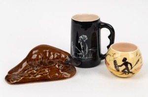 MARTIN BOYD pottery vase with Aboriginal hunting scene on yellow ground; together with a black Australian pottery mug with Aboriginal figure and a BENDIGO POTTERY platypus statue, (3 items), the platypus 17cm long