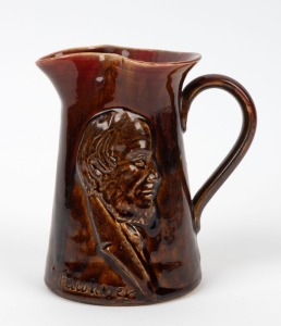 PAMELA "Fawkner, Souvenir Of Melbourne" brown and pink glazed pottery jug with portrait, incised "Pamela, 1934", 13.5cm high