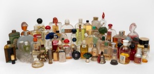 Fifty nine assorted perfume and eau de cologne bottles, the largest 19cm high