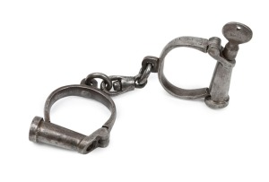 HIATT antique handcuffs with screw-key, 19th century, 22cm wide