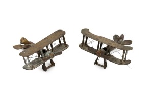 Two WW1 period trench art biplane ornaments, both engraved "PERONNE". 9.5cm wingspan each