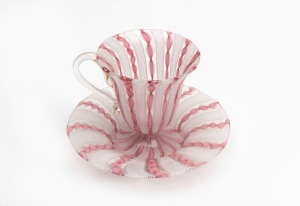 A latticino Murano glass cup and saucer, mid 20th century, the cup 8cm high