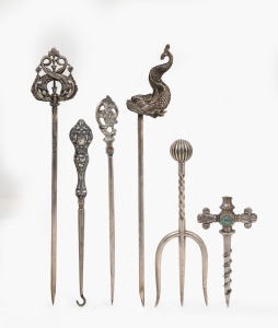 Three assorted silver meat skewers, a sterling silver boot hook, an antique silver plated bread fork, and a Maw & Sons tapping implement, 19th/20th century, (6 items), the largest 25cm long