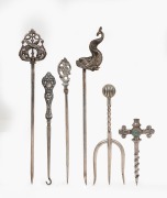 Three assorted silver meat skewers, a sterling silver boot hook, an antique silver plated bread fork, and a Maw & Sons tapping implement, 19th/20th century, (6 items), the largest 25cm long